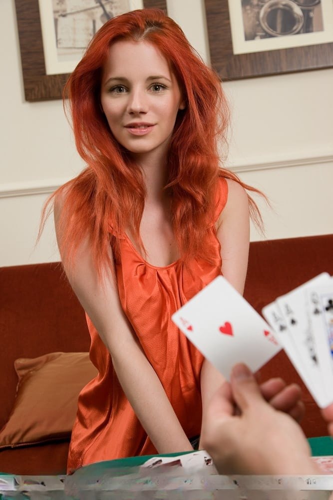 Hot redhead Ariel removes clothes after losing at poker & rolls in the chips