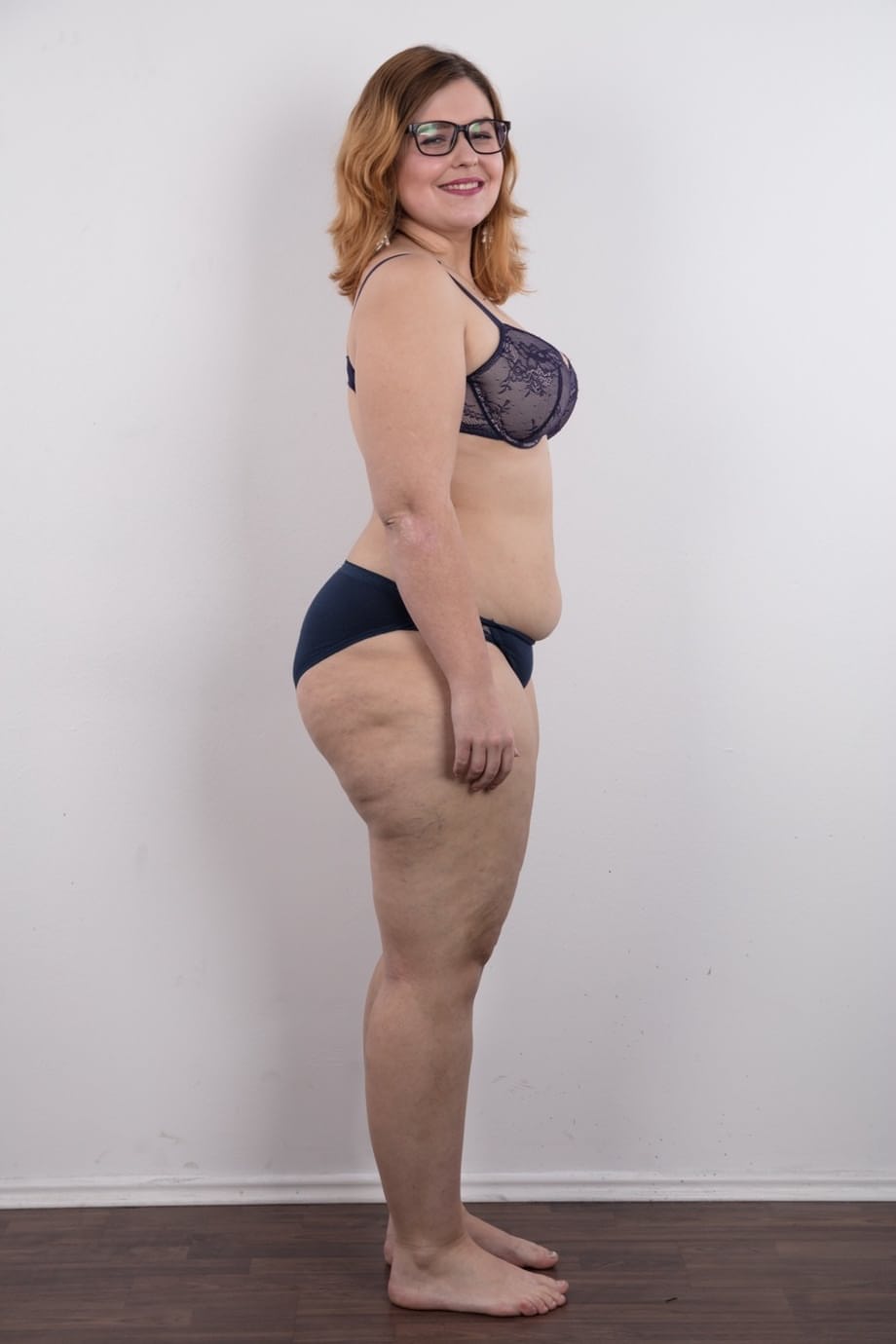Amateur fatty Karolina shows her flab in the nude wit her glasses on