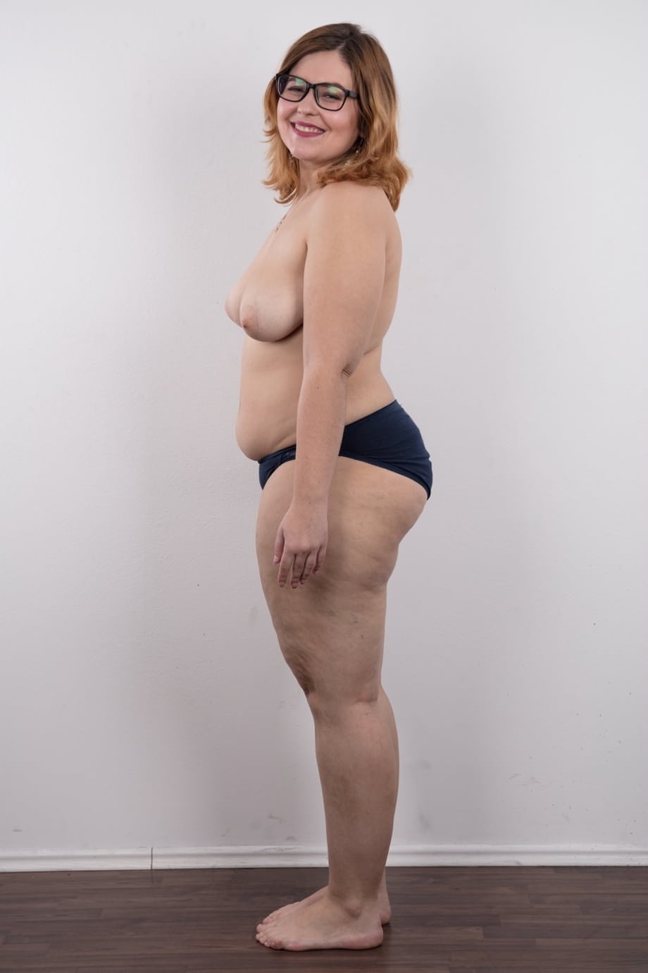 Amateur fatty Karolina shows her flab in the nude wit her glasses on