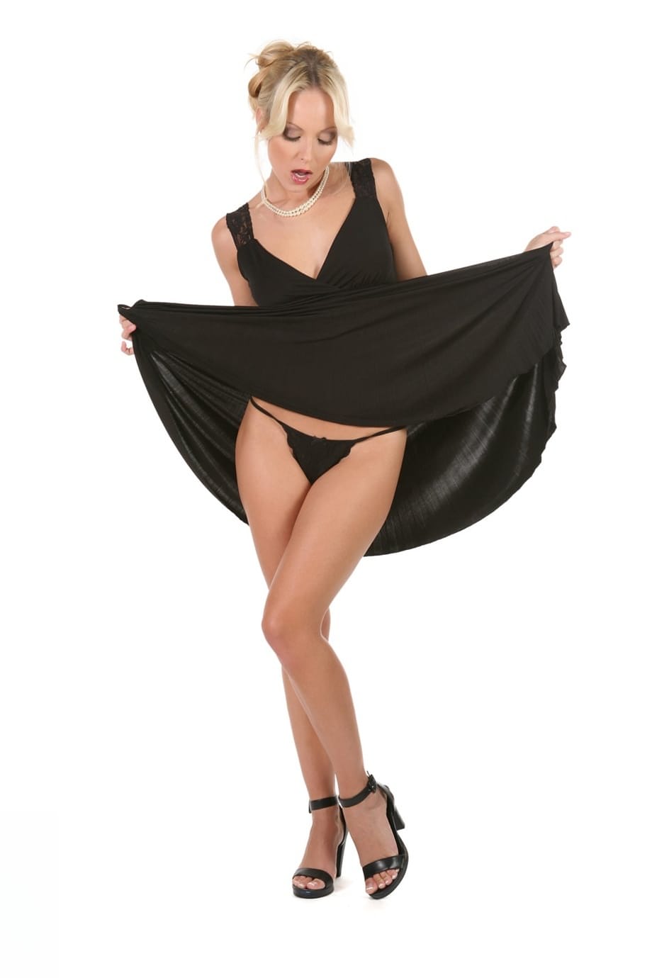 Hot blonde chick Jana Cova strips off her black dress and thong panties