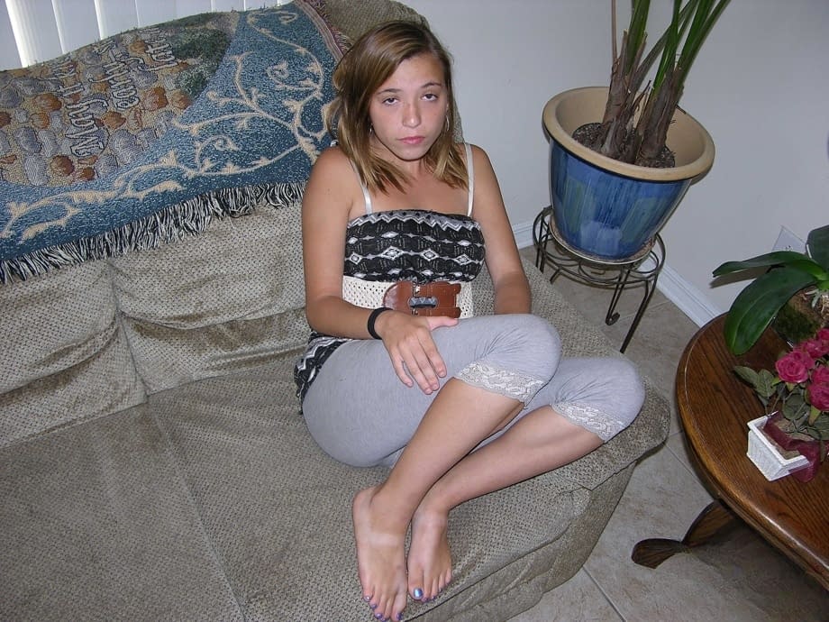Young looking first timer Alice W proudly shows her butthole and bald pussy