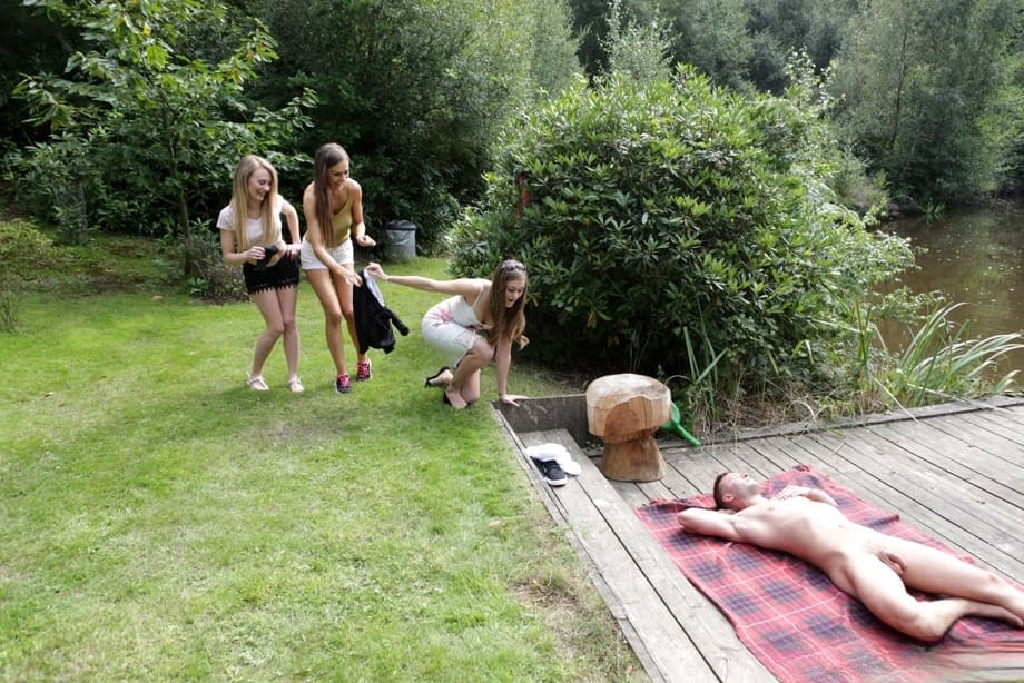 Three hotties please a horny voyeur by the side of a private lake