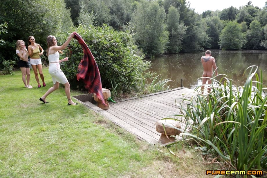 Three hotties please a horny voyeur by the side of a private lake