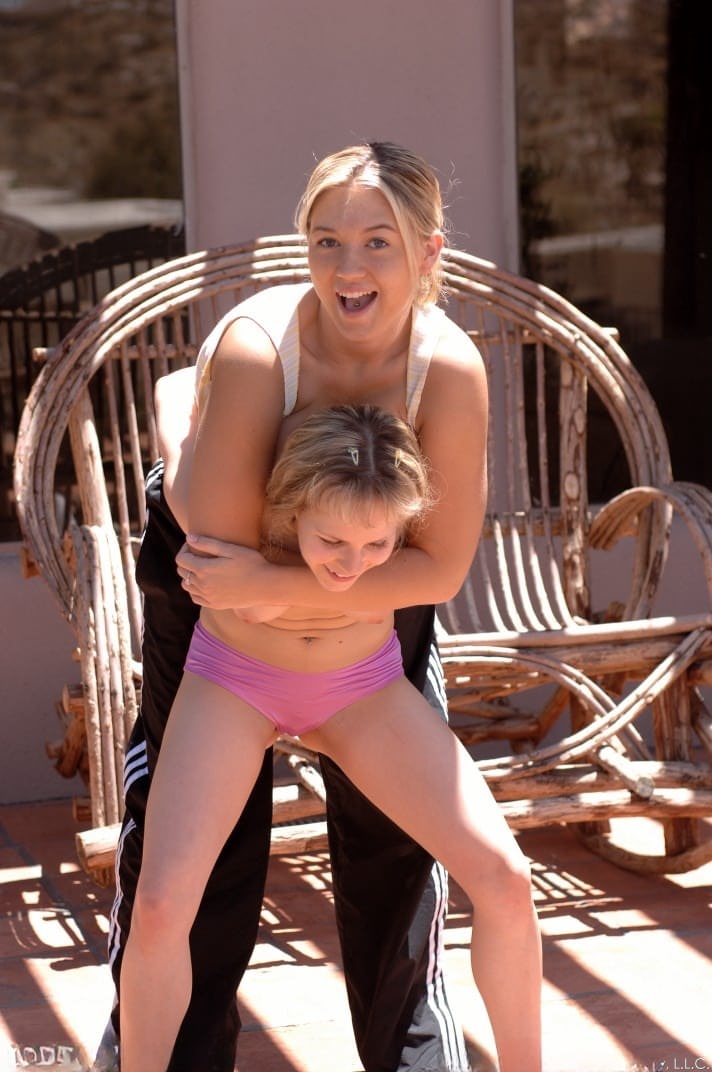 Cutie in pink panties Fiona Luv fights with busty Alison outdoors