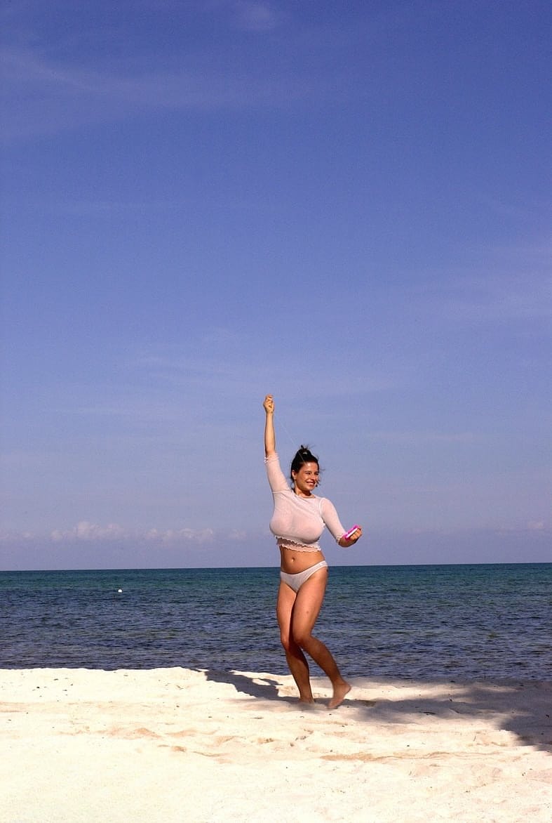 Super busty Chloe Vevrier letting her massive big tits hang loose at the beach