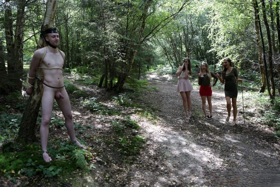 3 young girls walking in the woods find a restrained man and suck his cock