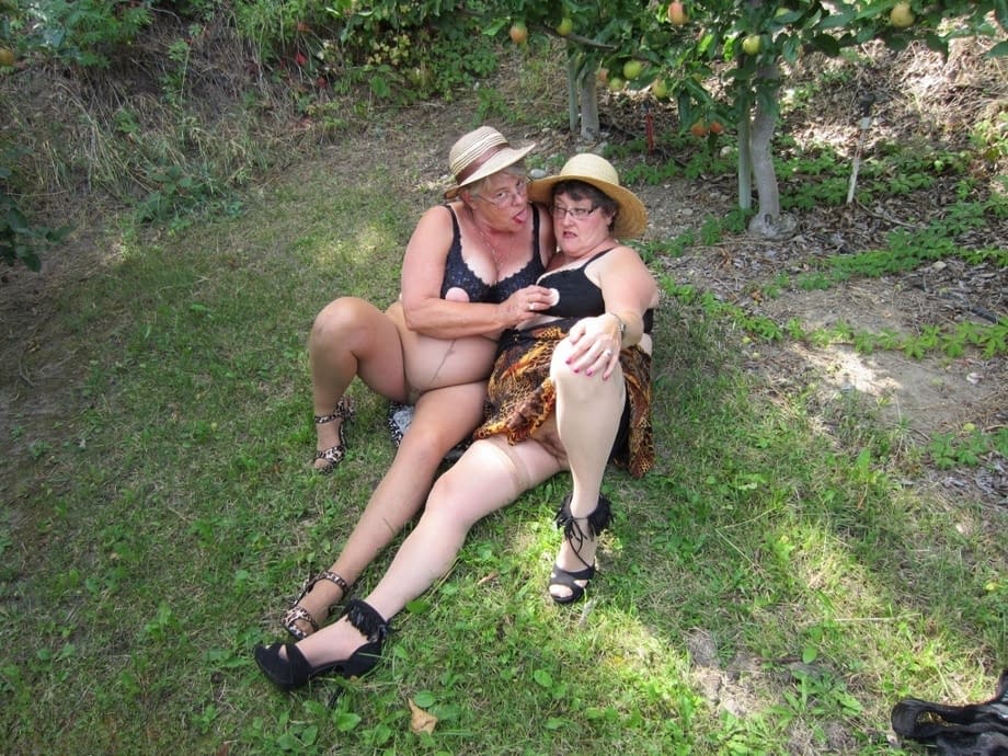 Older granny Girdle Goddess & her aged gal pal showing ass & nipples outdoors