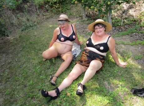 Older granny Girdle Goddess & her aged gal pal showing ass & nipples outdoors