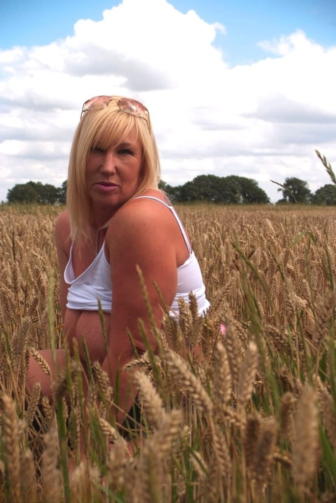 Chubby mature MILF Melody reveals great big tits & flashes hot ass in a field