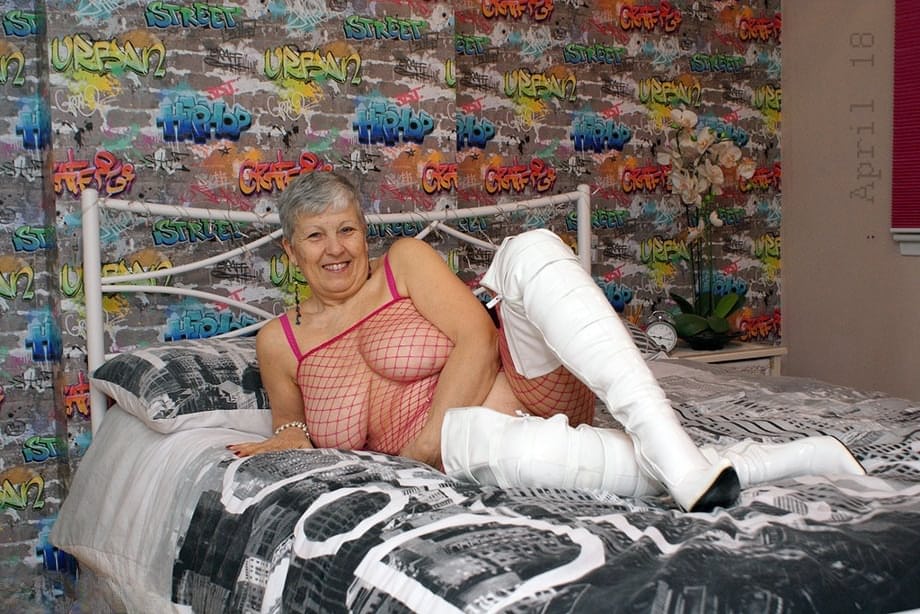 Bold granny Savana in thigh poses in fishnet body stocking & thigh high boots