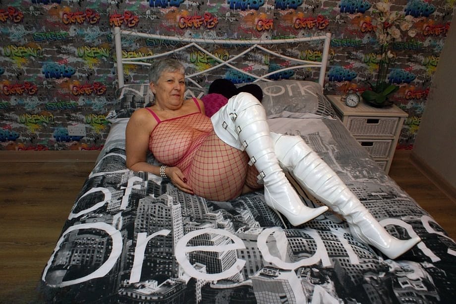 Bold granny Savana in thigh poses in fishnet body stocking & thigh high boots