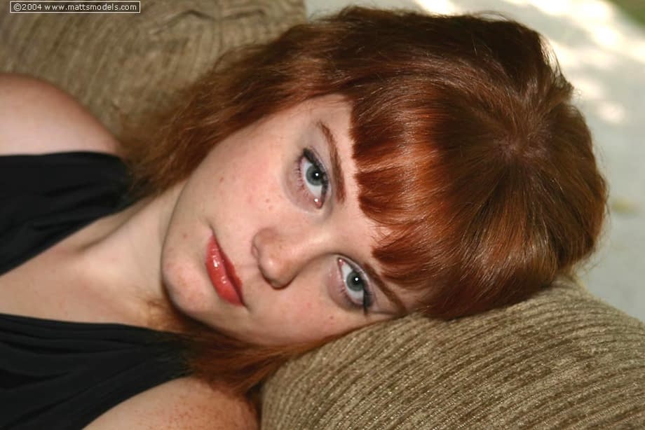 Natural redhead Sawyer cups her big boobs after getting naked for first time