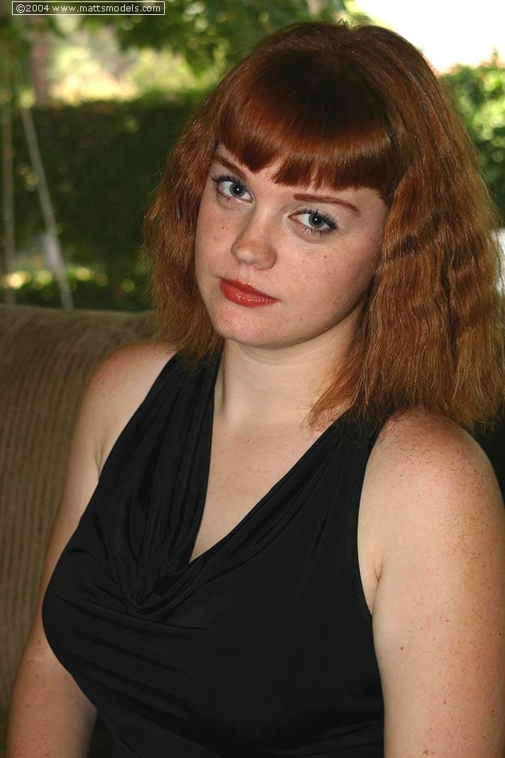 Natural redhead Sawyer cups her big boobs after getting naked for first time