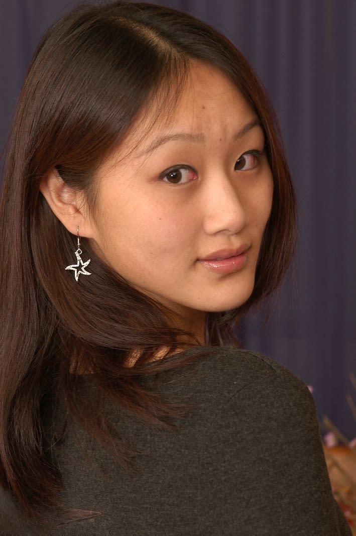 Asian first timer Evelyn spreads her bare legs and labia lips too