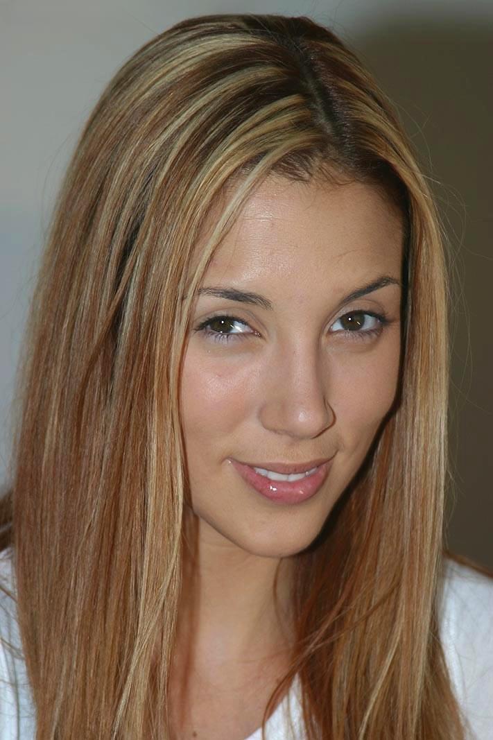 Blonde solo girl Jelena uncovers her nice tits as she peels off her clothes