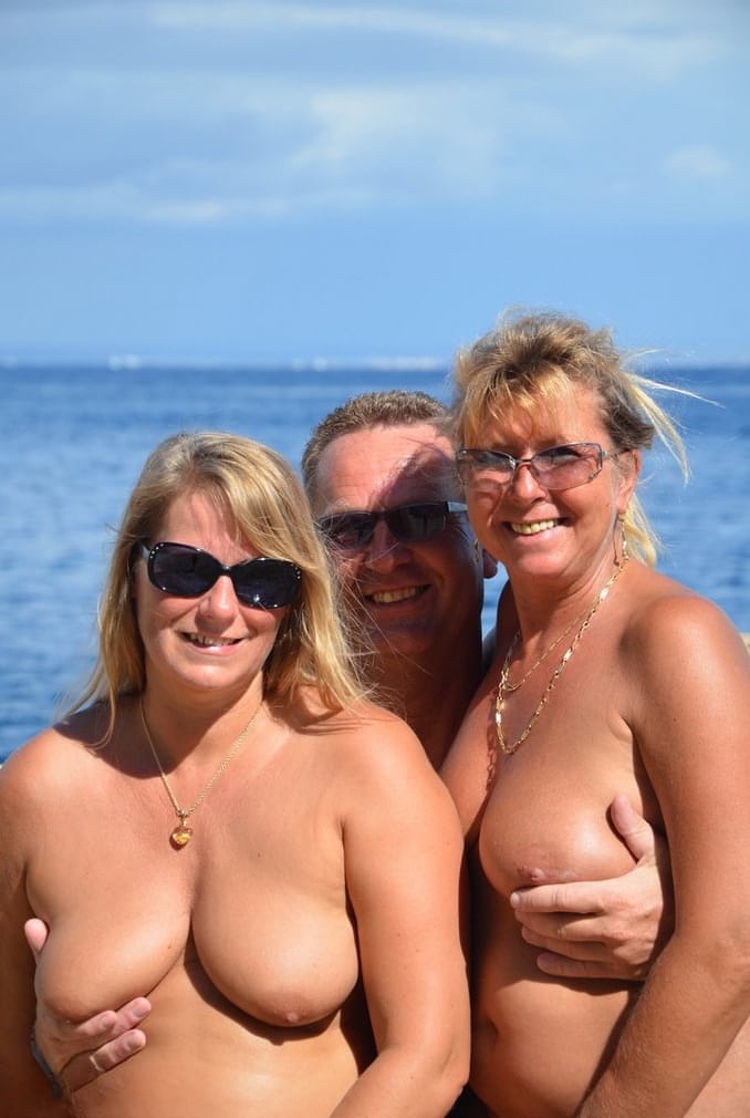Two blonde women with saggy tits enjoy hot suck and fuck in beach threesome