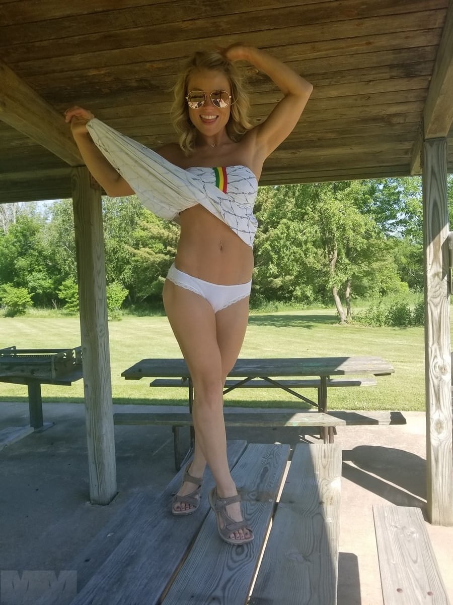 Sexy blonde with sunglasses Meet Madden sunbathing topless in the nature