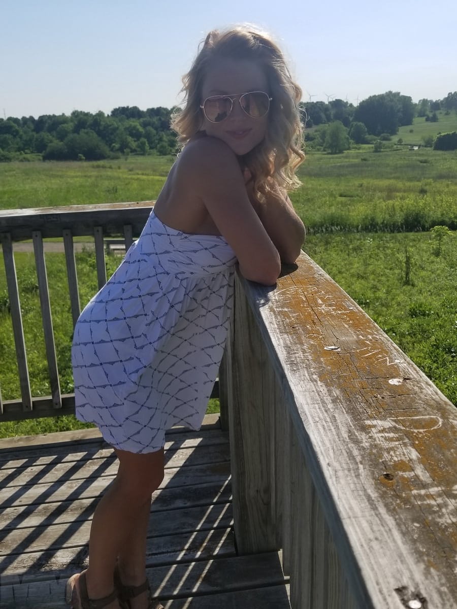 Sexy blonde with sunglasses Meet Madden sunbathing topless in the nature