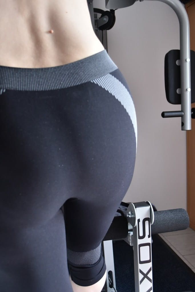 Fit older lady shows off her saggy tits while working out at the gym