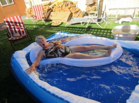 Fatty mature granny Girdle Goddess peels to enjoy wading pool skinny dip