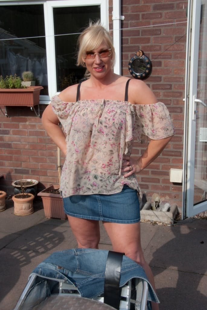 Busty mature wife Melody strips on the patio showing big tits & masturbating