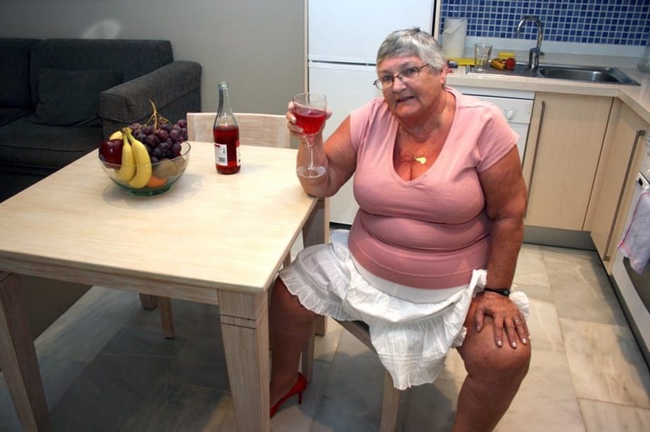 Mature BBW Grandma Libby strips in the kitchen to wine & dine & toy pussy nude