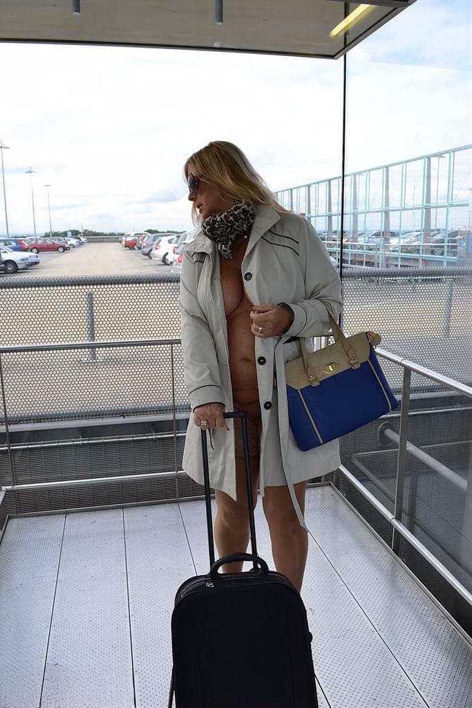 Kinky big tit mature exhibitionist wears nothing underneath coat in public
