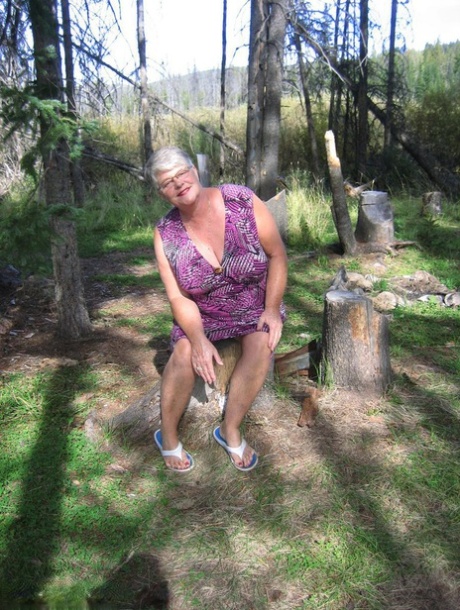Fat granny Girdle Goddess loses her purple outfit in the woods and poses nude