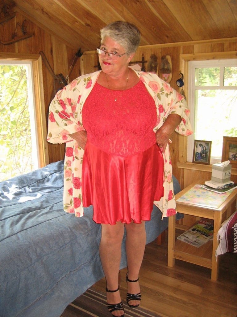 Short haired granny Girdle Goddess stripping to her stockings and high heels