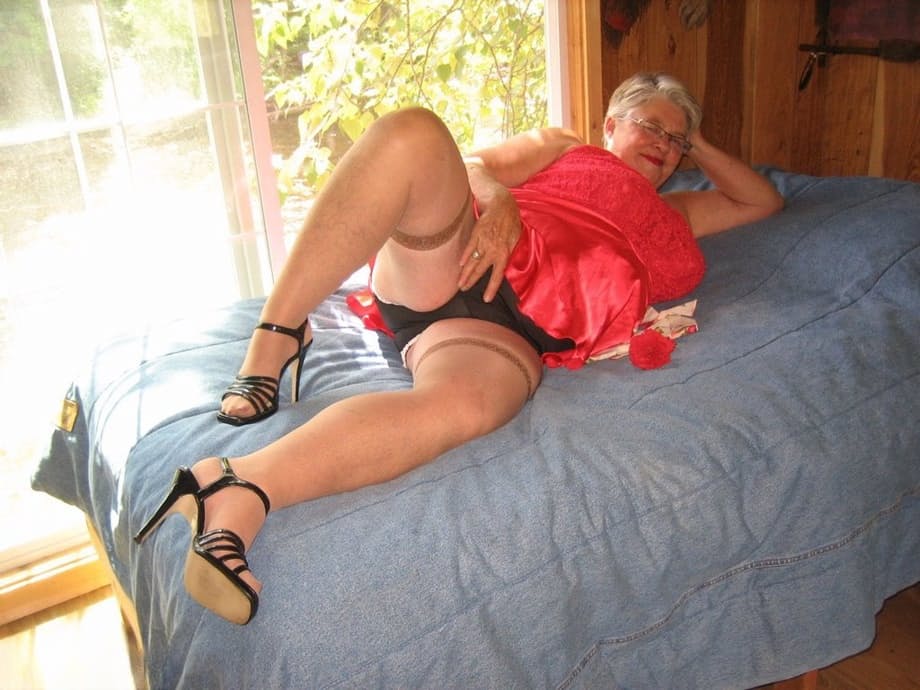 Short haired granny Girdle Goddess stripping to her stockings and high heels