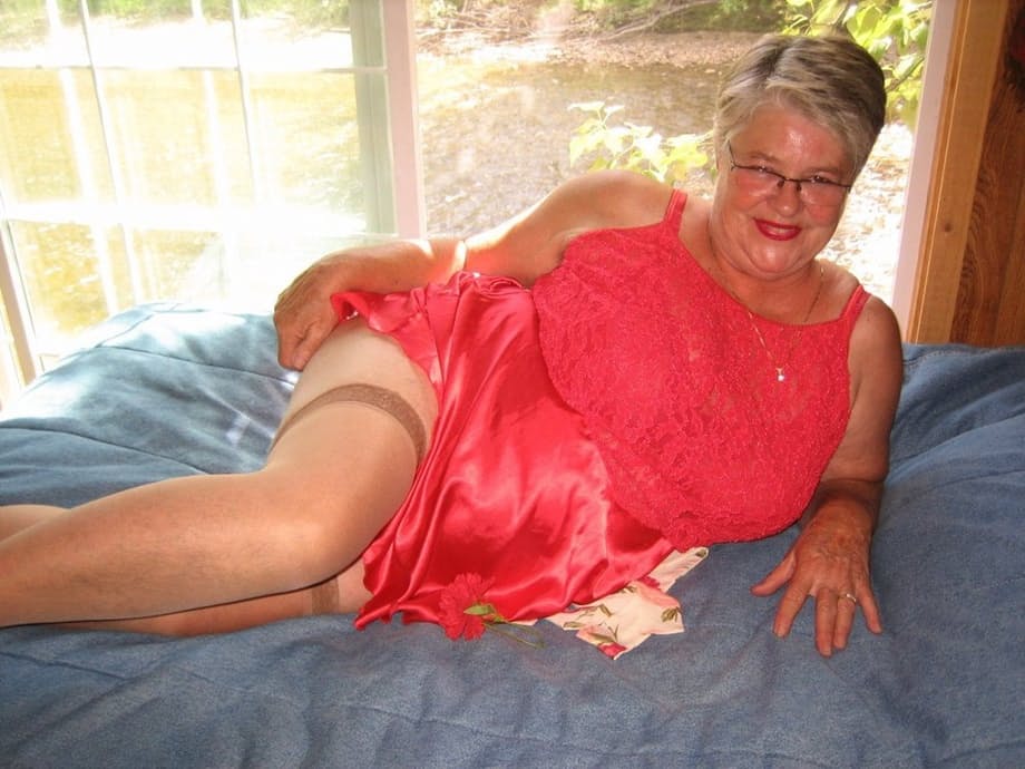 Short haired granny Girdle Goddess stripping to her stockings and high heels