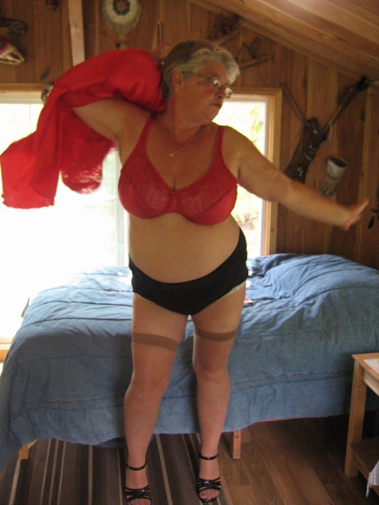 Short haired granny Girdle Goddess stripping to her stockings and high heels
