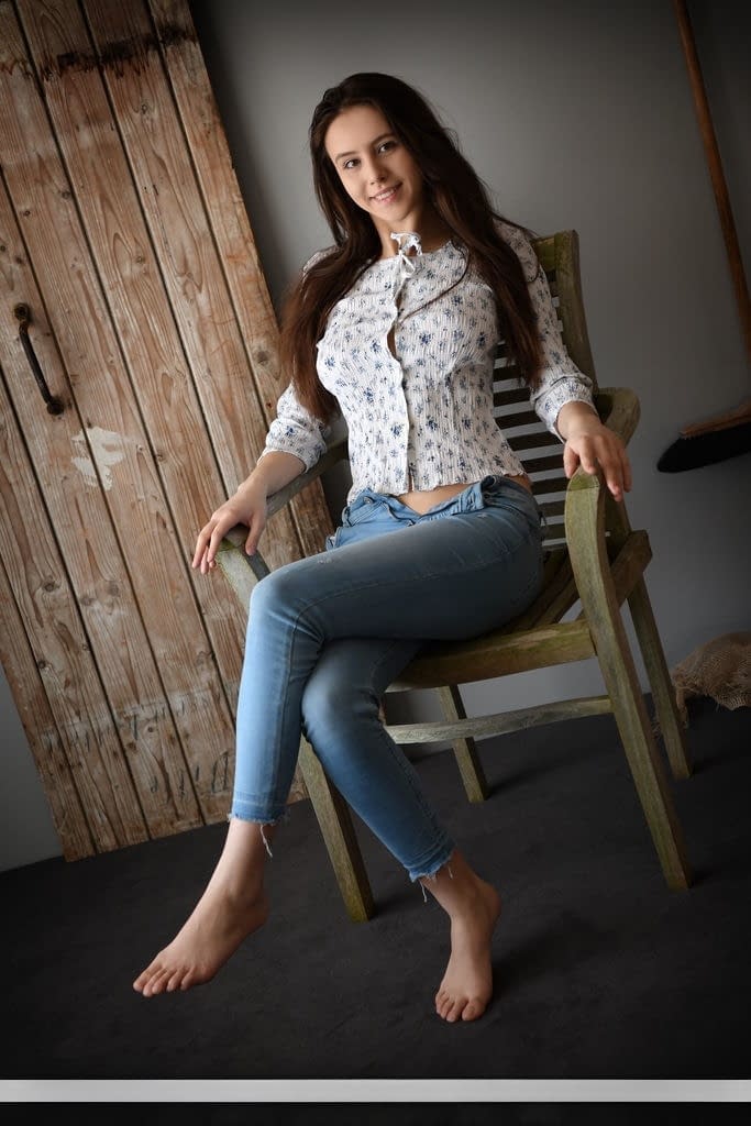 Sweet brunette teen Alisa Amore removes blue jeans on way to modeling naked