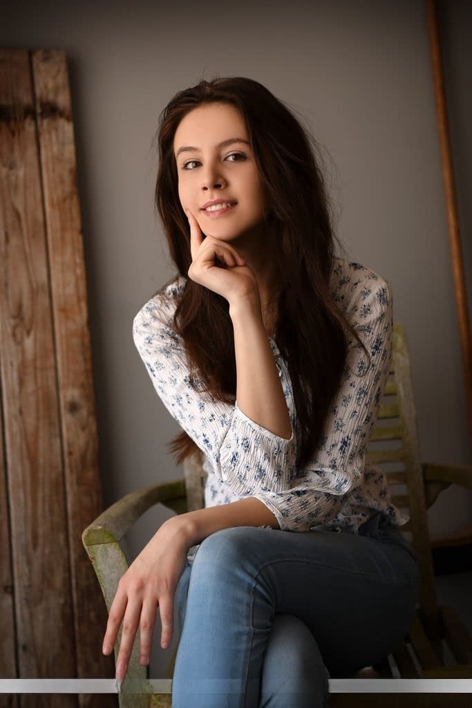 Sweet brunette teen Alisa Amore removes blue jeans on way to modeling naked