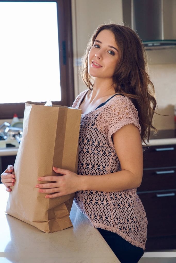 Petite brunette Sybil A poses her naked teen body on kitchen counter in socks