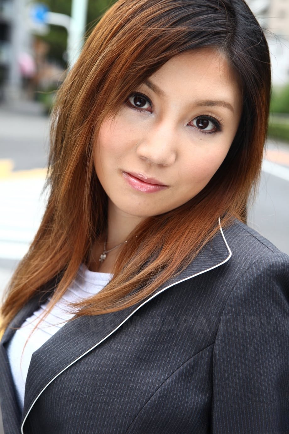 Attractive Japanese MILF Yuria Kanno posing in public in her sexy uniform