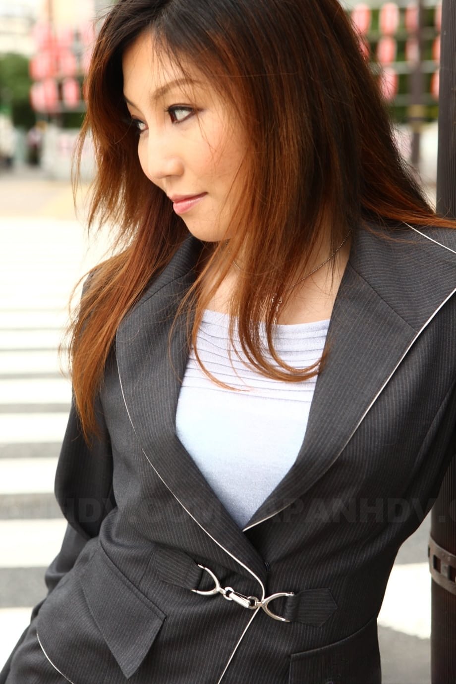 Attractive Japanese MILF Yuria Kanno posing in public in her sexy uniform