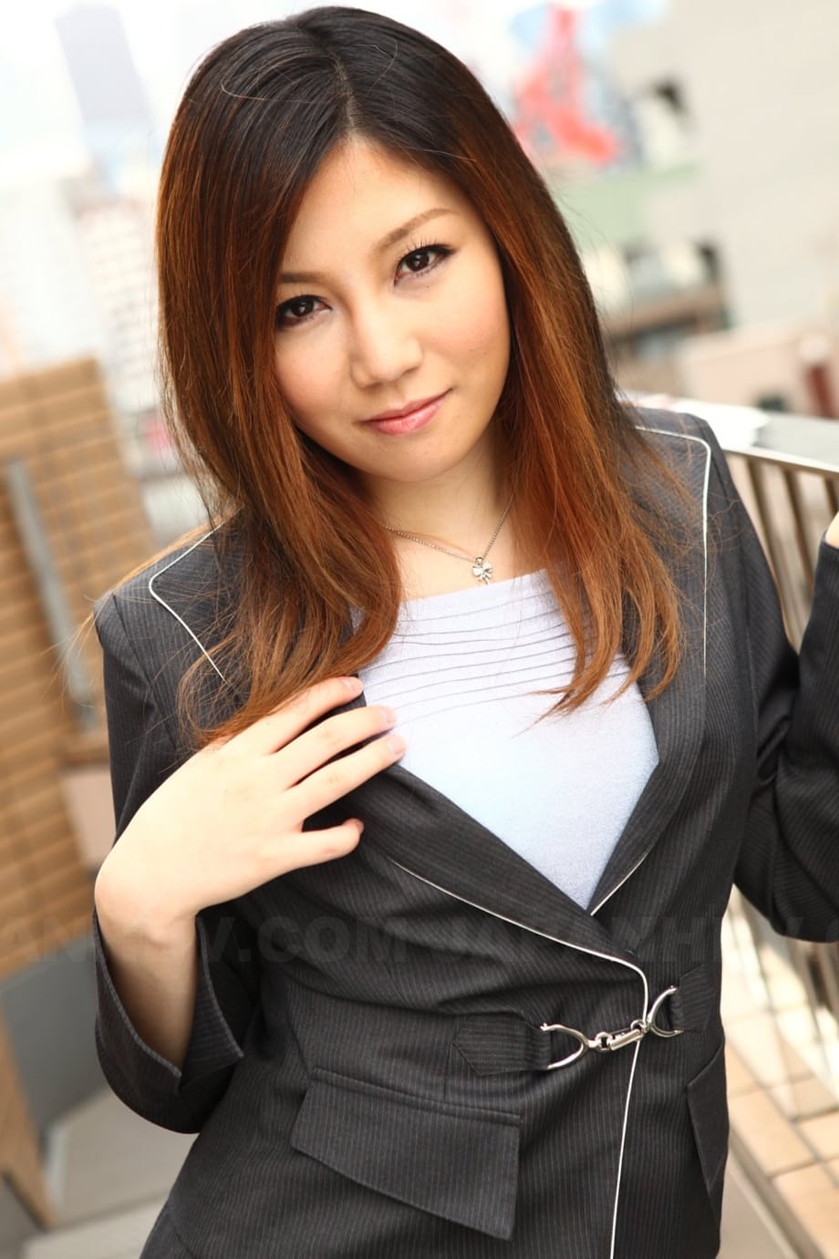 Attractive Japanese MILF Yuria Kanno posing in public in her sexy uniform