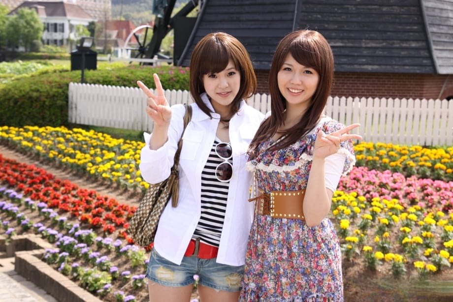 Japanese lesbians Rimu Endo & Ueno Misaki show bare legs while taking a stroll
