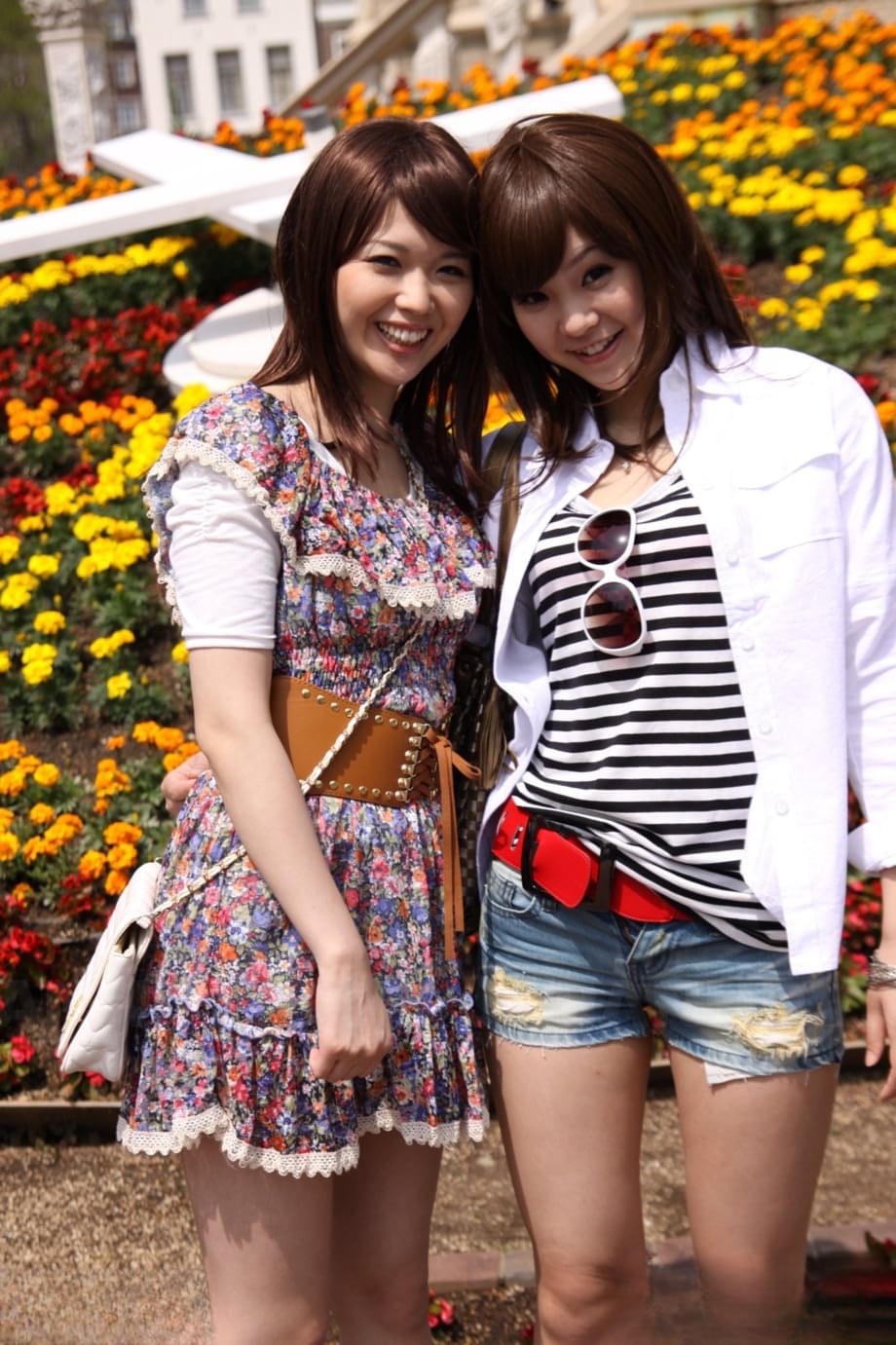 Japanese lesbians Rimu Endo & Ueno Misaki show bare legs while taking a stroll