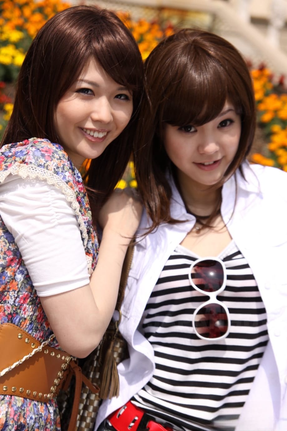 Japanese lesbians Rimu Endo & Ueno Misaki show bare legs while taking a stroll