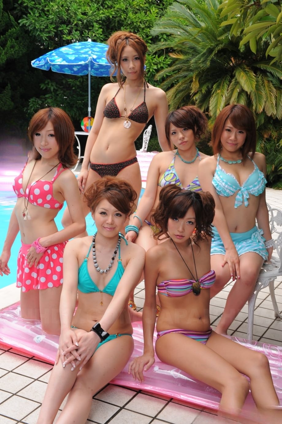 Sweet Japanese girlfriends in sexy swimsuits flaunt their beauty poolside