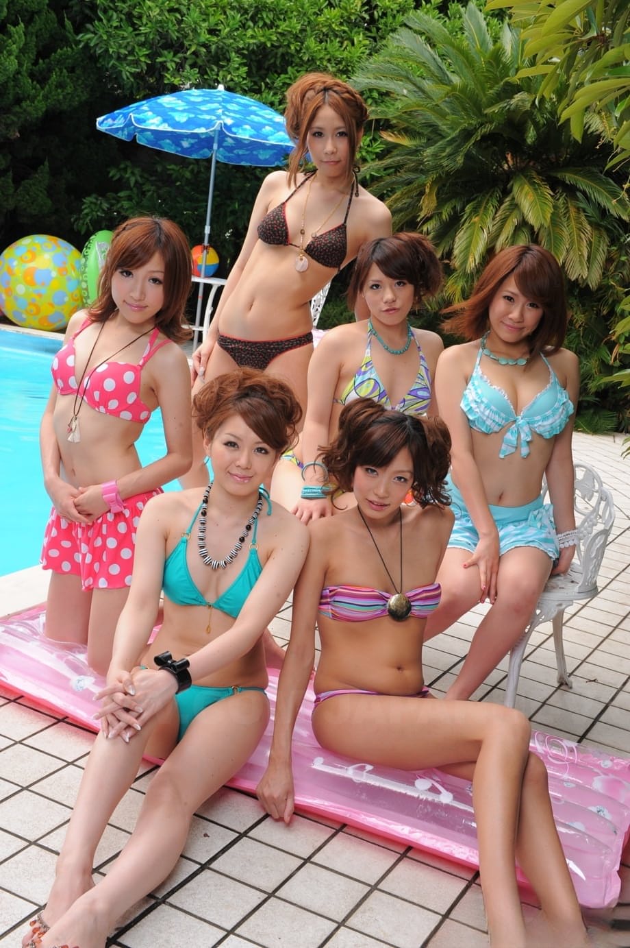 Sweet Japanese girlfriends in sexy swimsuits flaunt their beauty poolside