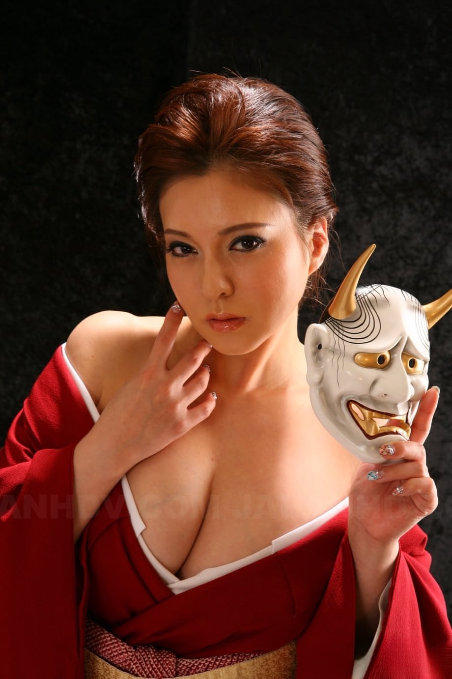 Japanese model Yuki Tsukamoto fondles her firm boobs as she gets naked