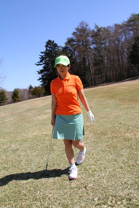 Japanese golfer Nana Kunimi flashes no panty upskirt while lining up a putt