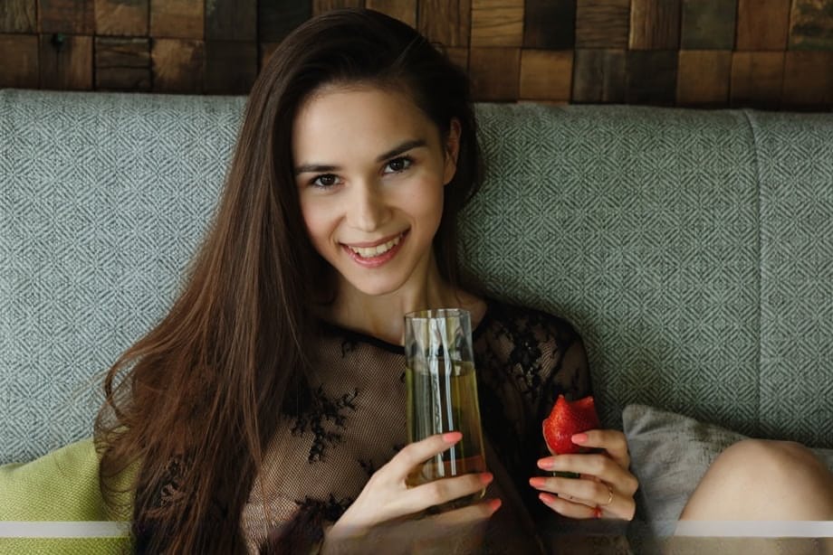 Beautiful teen Leona Mia showcases her pussy after eating strawberries
