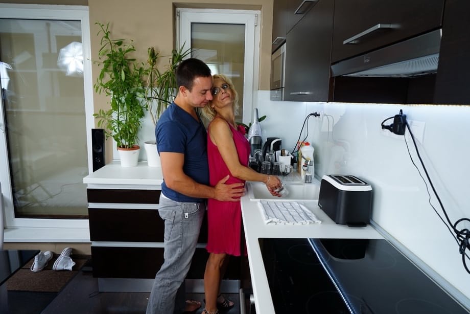 Thin housewife of advancing years gets banged by her toy boy in the kitchen