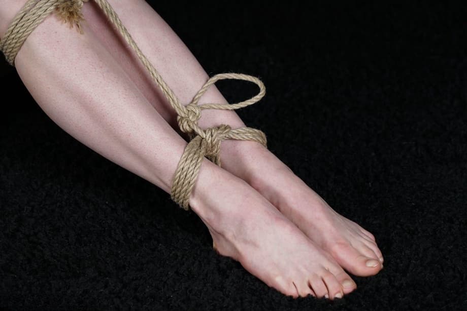 Naked blonde finds her nipples sticking out as she struggles against rope ties