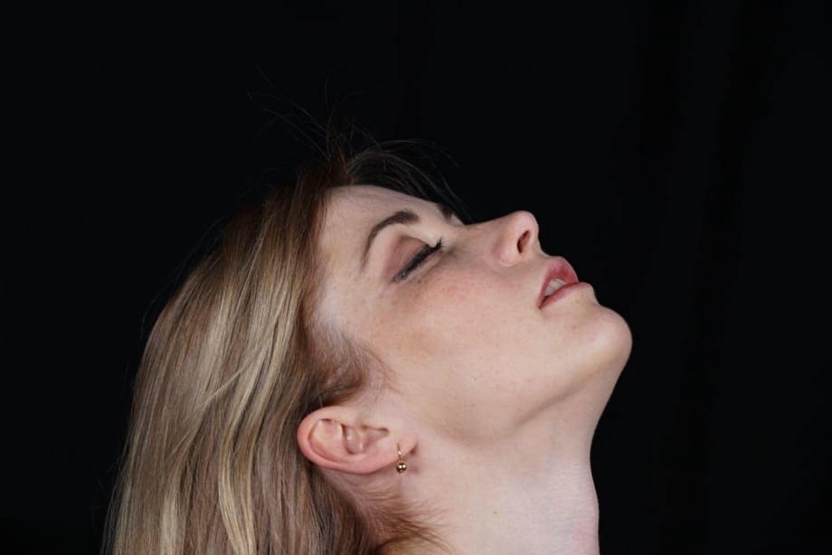 Naked blonde finds her nipples sticking out as she struggles against rope ties