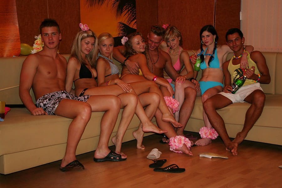 Horny college students partake in group sex during a Hawaiian themed party